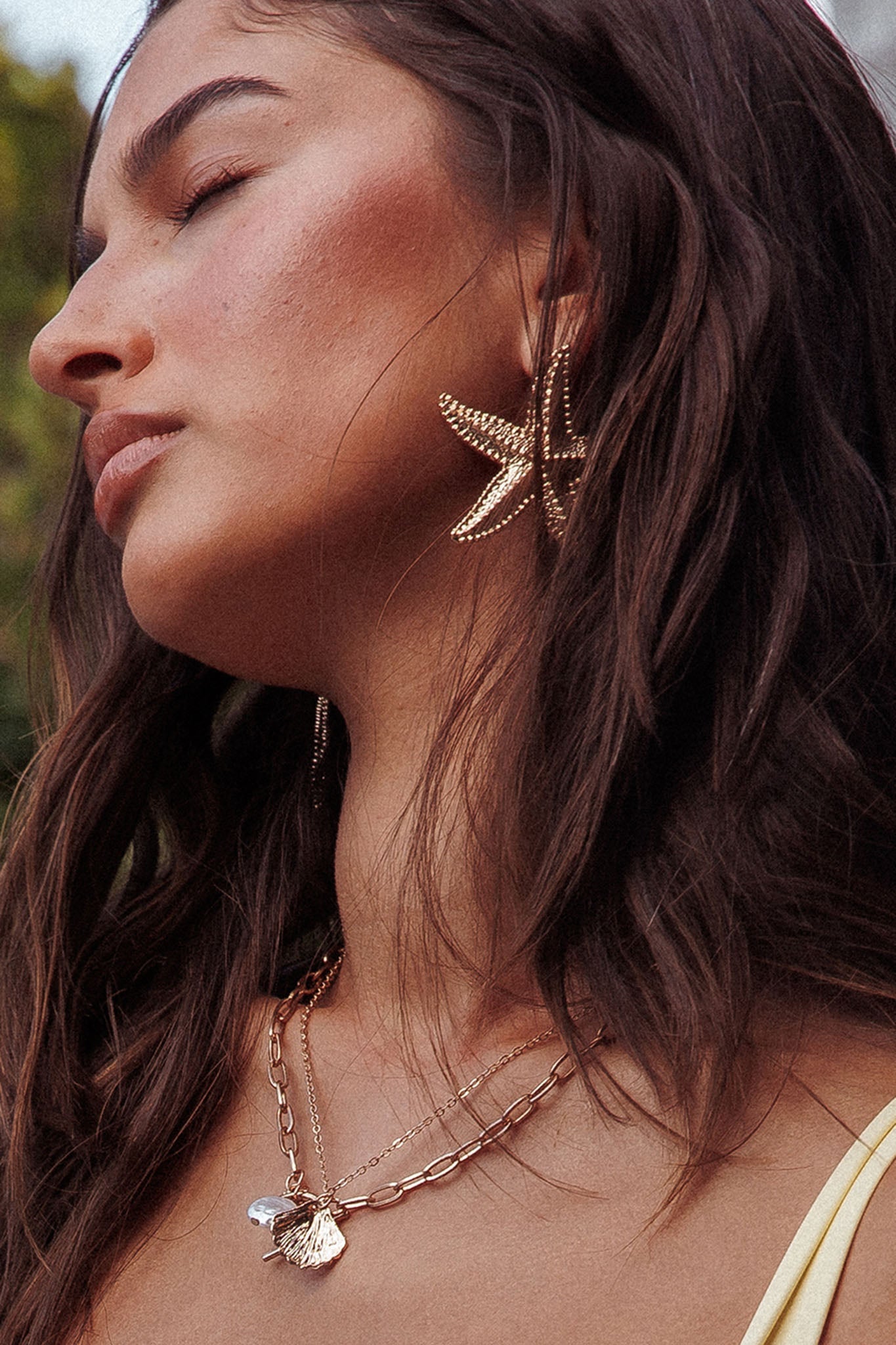 Delphin hangende oorbellen zeester in goud - Bellanza