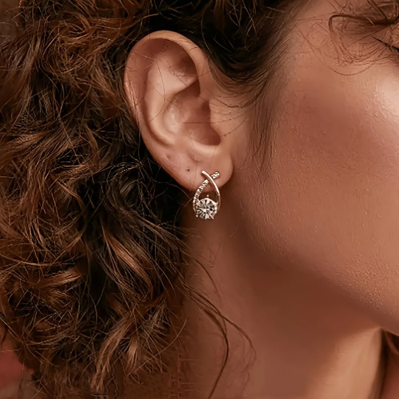 Oorbellen met gouden kruis en zirconia - Bellanza