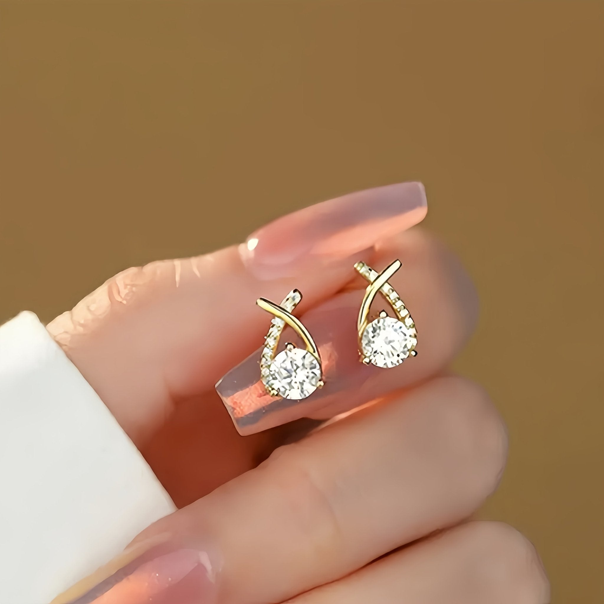 Oorbellen met gouden kruis en zirconia - Bellanza