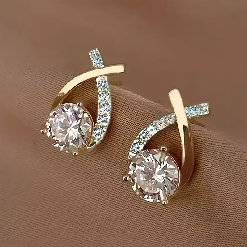 Oorbellen met gouden kruis en zirconia - Bellanza