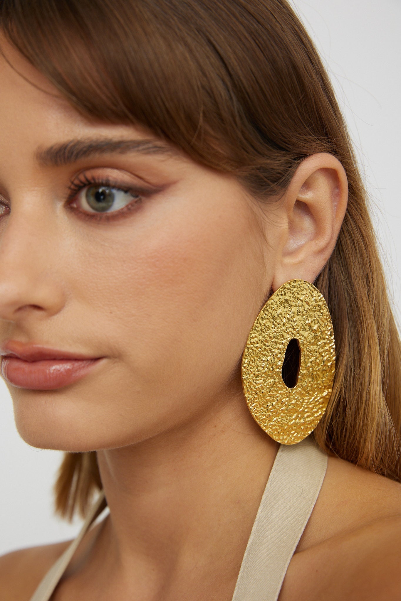 Relief disc oorbellen Eldorado Goud - Bellanza